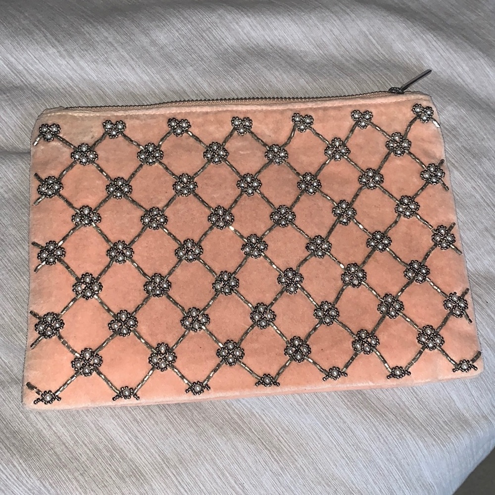 Brand new never used! Tags still on. Pink clutch